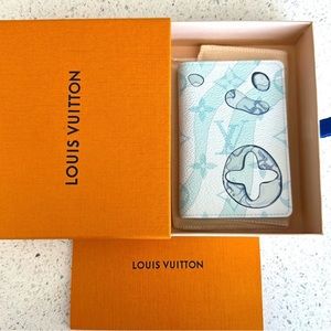 Brand new Louis Vuitton Monogram
Aquagarden Pocket Organizer.